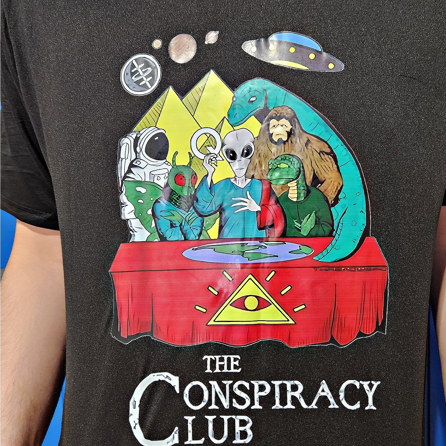 CONSPIRACY CLUB Dri-Fit Tee: Bigfoot Nessie NASA Moth Man Aliens & Freemasons